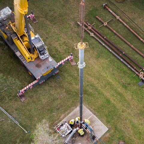 Crane operating near water piping and infrastructure