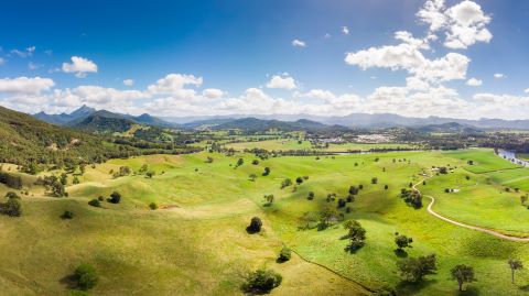 An aerial view of the hinterland near the town of Murwillumbah in north-east NSW, with the Wollumbin National Park in the background.