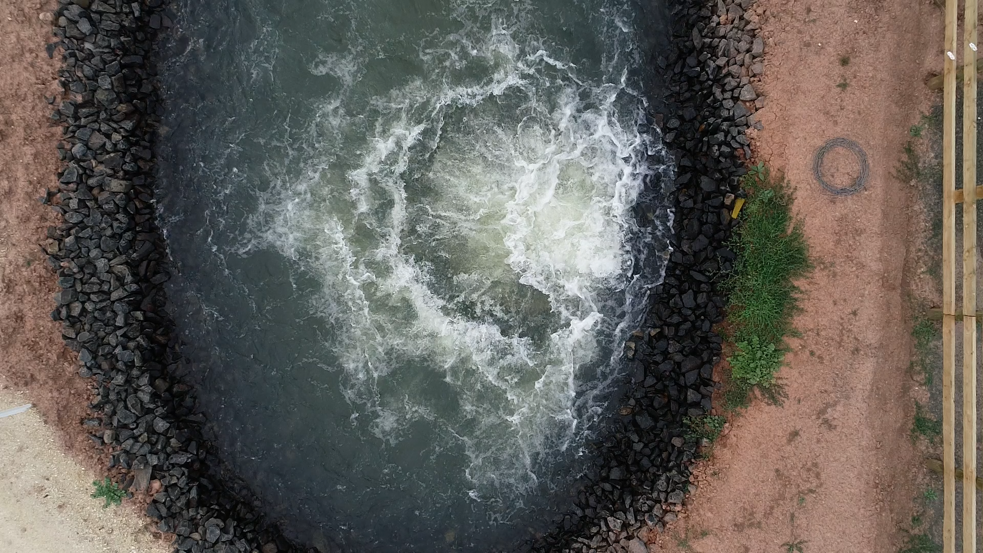 Overhead view of water coming out of pipeline at Macalister Irrigation District in Victoria